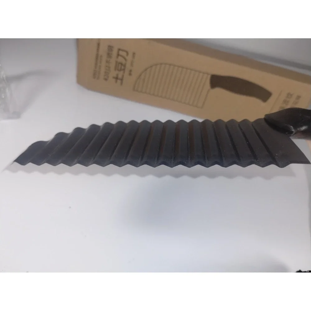 New in box potato knife black wavy